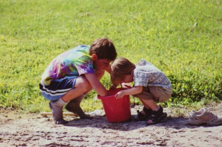 Me and cousin Matthew digging for worms.. Look at Matthews socks?!?!?